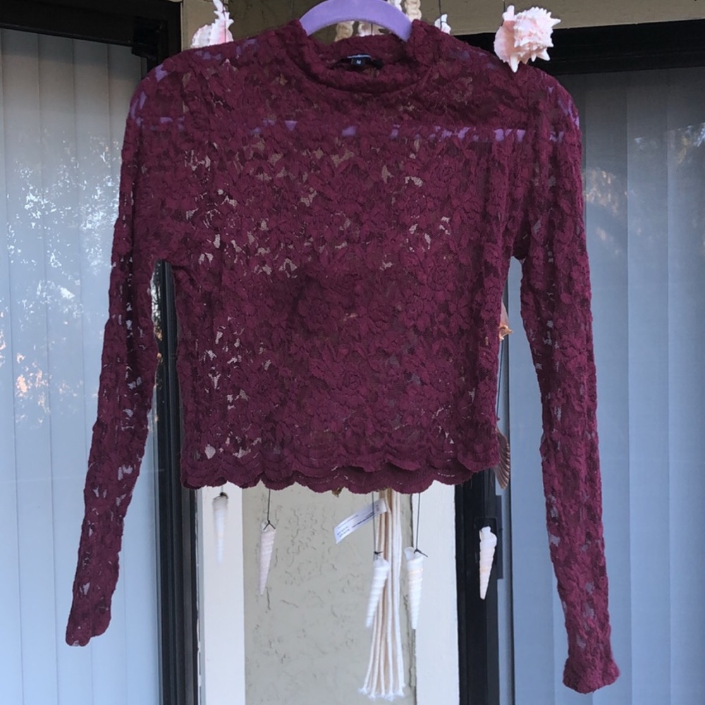 A maroon lace crop top super flattering